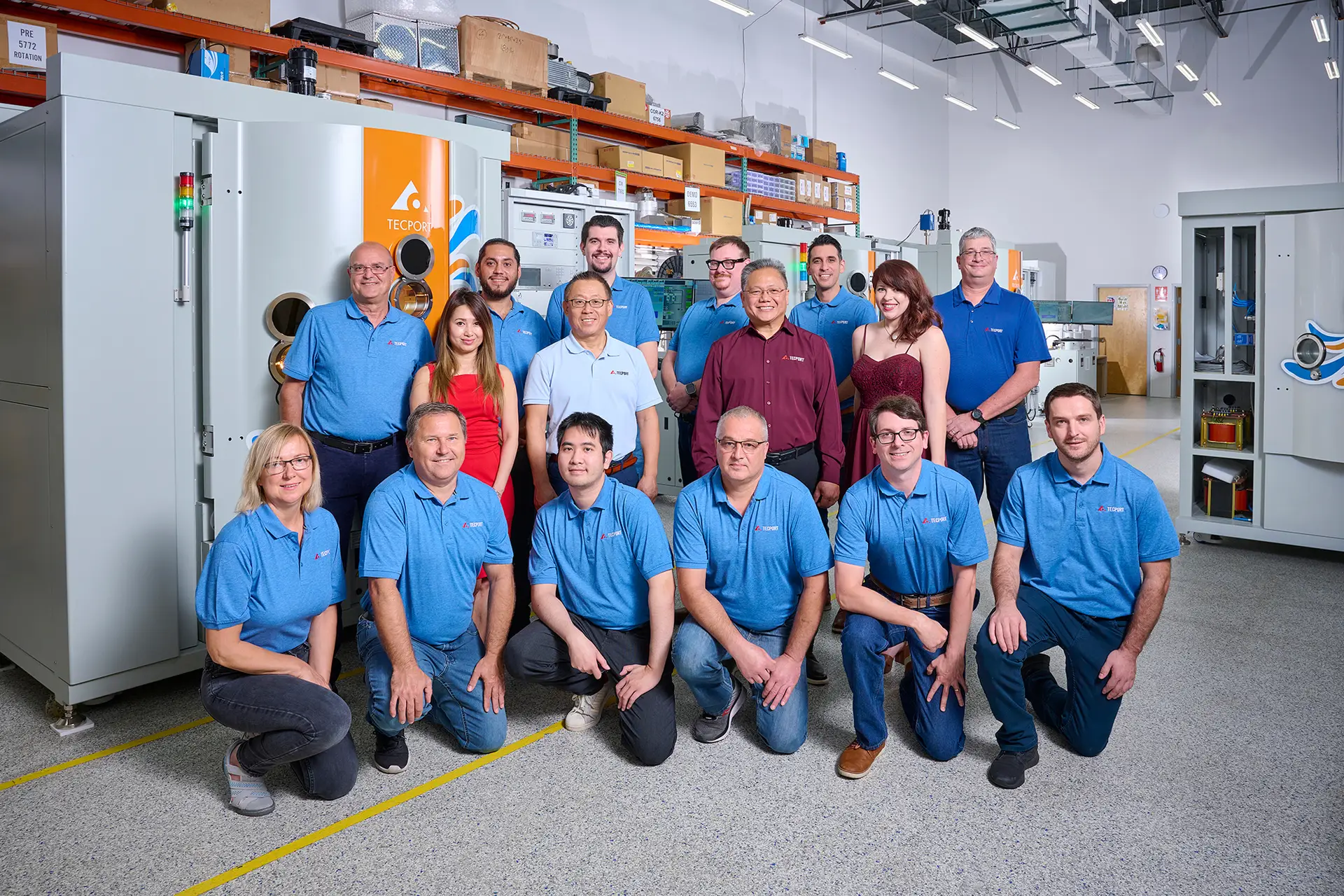 tecport team photo in front of tecport's symphony precision model inside of warehouse