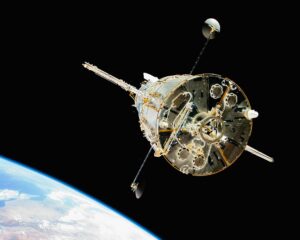 a satellite in orbit with the earth in the background
